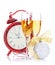 Two champagne glasses, christmas decor and clock