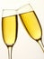 Two champagne glasses in toast