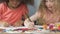 Two charming little girls with different ethnicity playing together, friendship