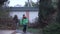 Two cheerful Caucasian children running back home from school. Brother and sister in autumn clothes with backpacks