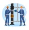 Two cheerful oilmen turn a pipeline valve