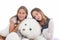 two cheerful preteen girls with big teddy bear