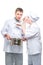 Two chefs in suits try the cooked soup