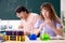Two chemists students in classroom