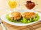 Two chicken cutlets on the green leaf lettuce