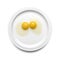 Two chicken egg yolks on a plate