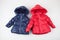 Two child warm jackets. Red and blue