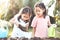 Two children asian little girl having fun to prepare soil