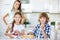 Two children baking fruitcake