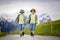 Two children, boy brothers, walking on a little path in Swiss Ap