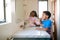 Two Children Brushing Their Teeth In Bathroom At Home