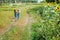 Two children with a butterfly net walk through the countryside