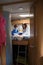 Two children on a campervan bed during a road trip stop