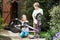 Two Children Cleaning Bike Together