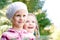 Two children in colorful knitted clothing