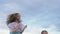 Two children dance and indulge on the beach.