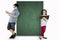Two children leaning on a blank chalkboard