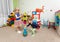 Two children play with plastic rings in kindergarten