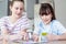 Two Children Playing Generic Board Game At Home Together