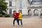 Two children, playing in the rain in front of the Le Lude castle