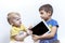 Two children quarrel, because of the tablet PC, children`s conflict