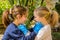 Two Children that remove medical Masks after the coronavirus quarantene and Discover their smiling Faces