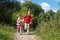 Two children run on path in summer