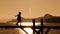 Two Children Running On Bridge At Sunset