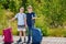 Two children, school boys with suitcases before leaving for summer vacation camp. Happy kids, siblings, twins brothers