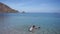 Two children snorkeling on beach