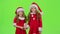 Two children are talking about the celebration of the new year. Green screen