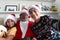 Two children and their grandfather taking a self portrait at Christmas time