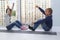 two children with their hands in air rejoice at end of quarantine. girl with pigtails and boy look at each other happily sitting