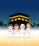 Two children with their parents are doing pilgrimage in front of ka`bah