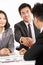 Two Chinese Businessmen Shaking Hands During Meet