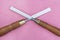 Two chisels on a pink background