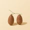 Two chocolate egg connected with branch concept. Stylish ivory background