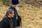 Two of Christian Orthodox priests walk along the field.