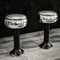 Two chrome and black stools