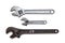 Two chrome-plated adjustable wrenches and one rusted on white