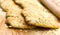 Two ciabatta bread loaf fresh bake close up photo on kitchen board