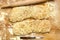 Two ciabatta bread loaf fresh bake close up photo on kitchen board