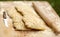 Two ciabatta bread loaf fresh bake close up photo on kitchen board