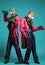 Two circus actors in zombie suit posing on studio