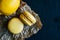 Two citron macaroons on a wooden background