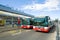 Two city buses at the bus stop near the Terminal 1 of the Vaclav Havel airport. Prague, Czech Republic