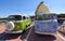 Two Classic VW Camper Vans parked in  seaside car park.