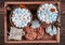 Two clay mugs with cocoa and marshmallows with a red heart, cookies on a wooden tray. Valentine`s day background. Top view
