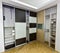 Two closets with sliding doors