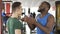 Two coaches of different nationalities arguing about time of training in gym